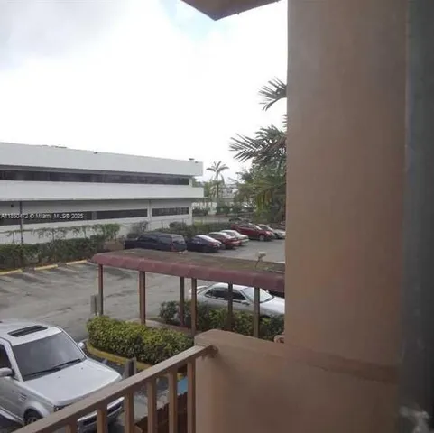 a view of balcony with furniture