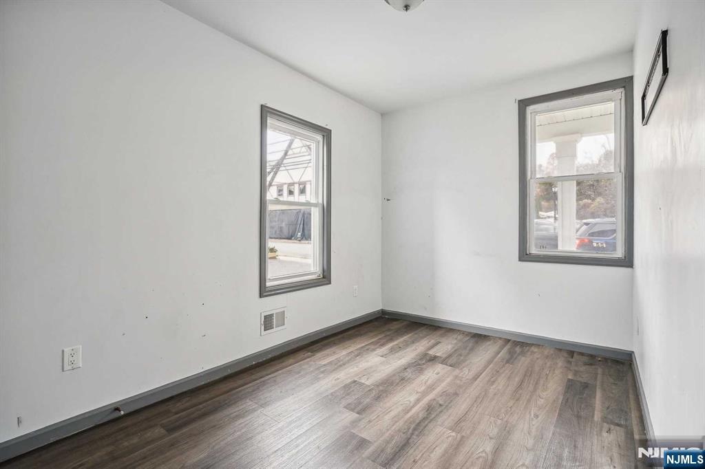 143 Valley Road, Unit 1R Montclair, NJ 07042 - Photo 9 of 18 an empty room with windows