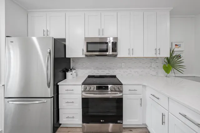 a kitchen with a sink and a refrigerator