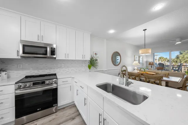a view of a balcony dining table and chairs