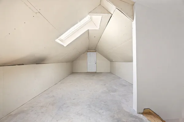 a view of a livingroom with furniture and a flat screen tv