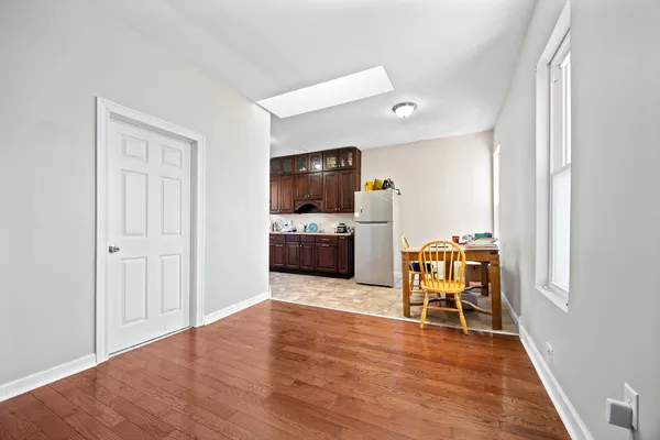 a kitchen with refrigerator and cabinets
