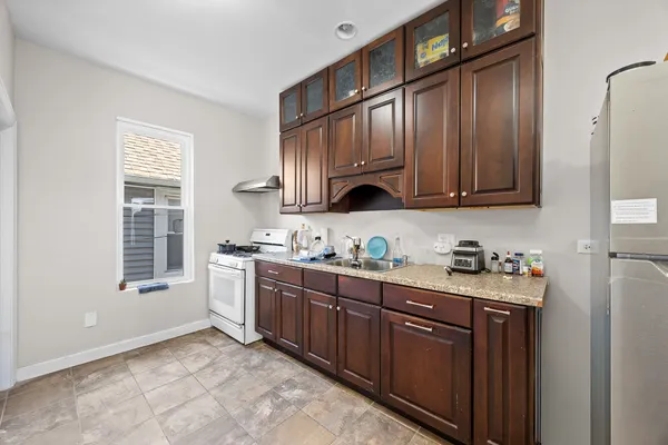 a bathroom with a sink a mirror and a shower