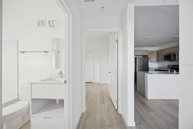a view of a bathroom from the hallway