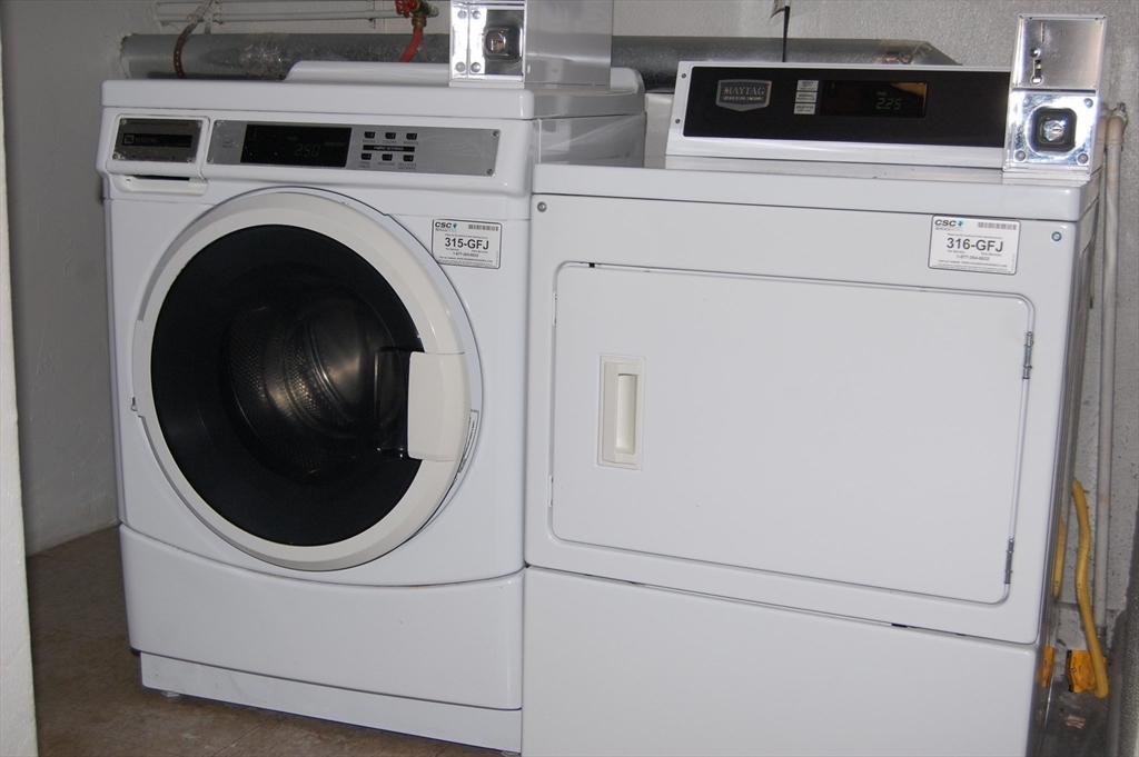 48 Will Drive, Unit 72 Canton, MA 02021 - Photo 14 of 19 a close up view of a washer and dryer