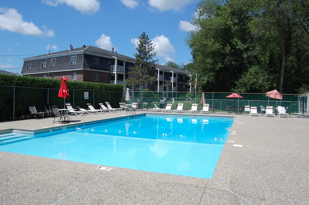 48 Will Drive, Unit 72 Canton, MA 02021 - Photo 17 of 19 a view of a swimming pool with a patio
