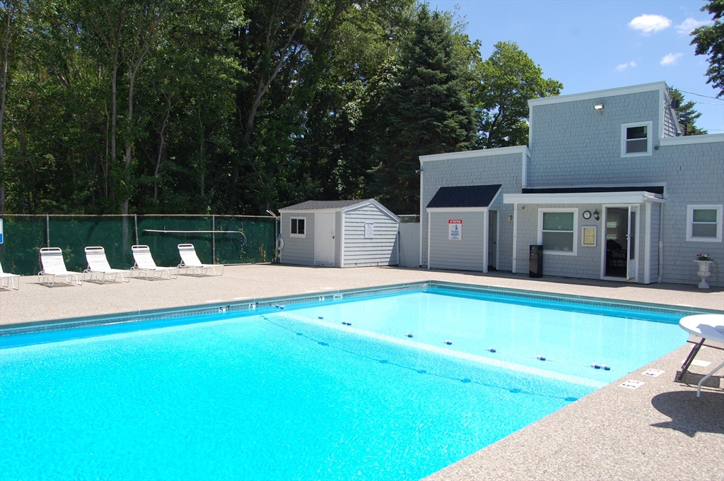 48 Will Drive, Unit 72 Canton, MA 02021 - Photo 19 of 19 a swimming pool with outdoor seating and yard