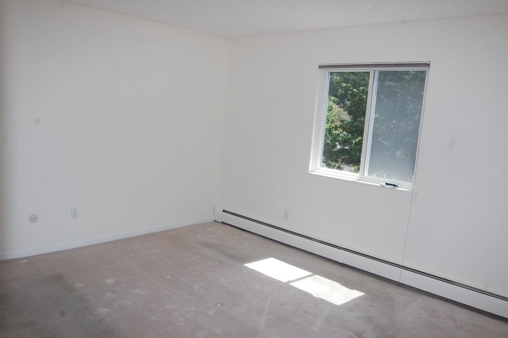 48 Will Drive, Unit 72 Canton, MA 02021 - Photo 10 of 19 an empty room with a window