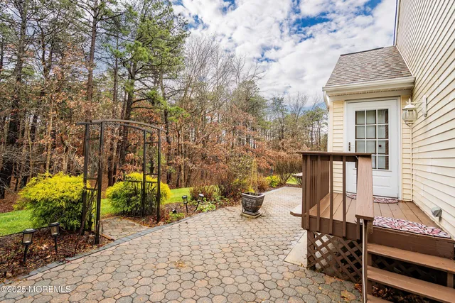 a front view of a house with outdoor seating