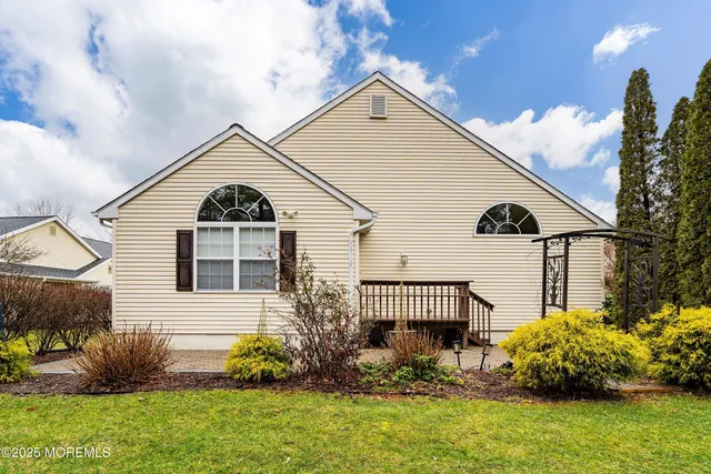 a view of a front of a house with a yard