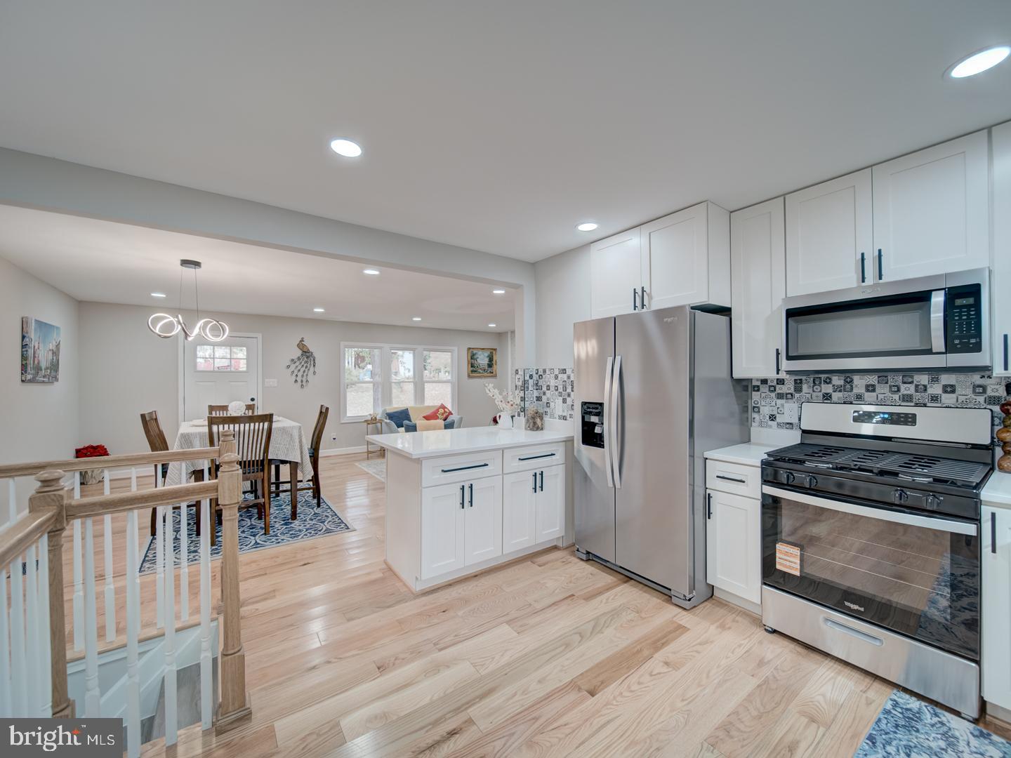 112 Courtney Drive Elkton, MD 21921 - Photo 16 of 40 a kitchen with white cabinets and stainless steel appliances