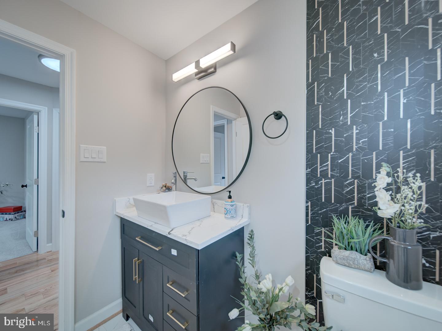 112 Courtney Drive Elkton, MD 21921 - Photo 18 of 40 a bathroom with a sink vanity and a mirror
