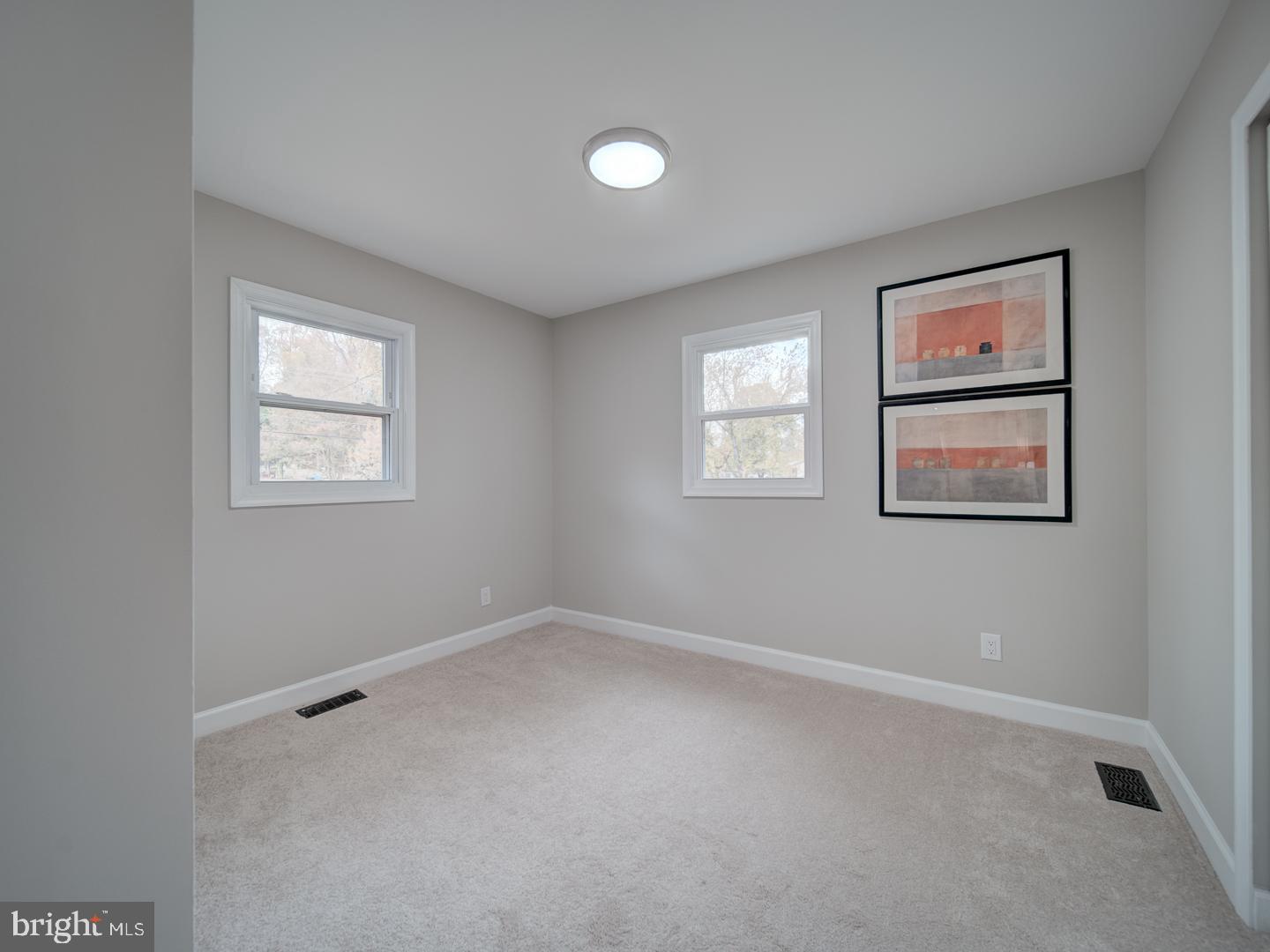 112 Courtney Drive Elkton, MD 21921 - Photo 20 of 40 an empty room with windows and closet