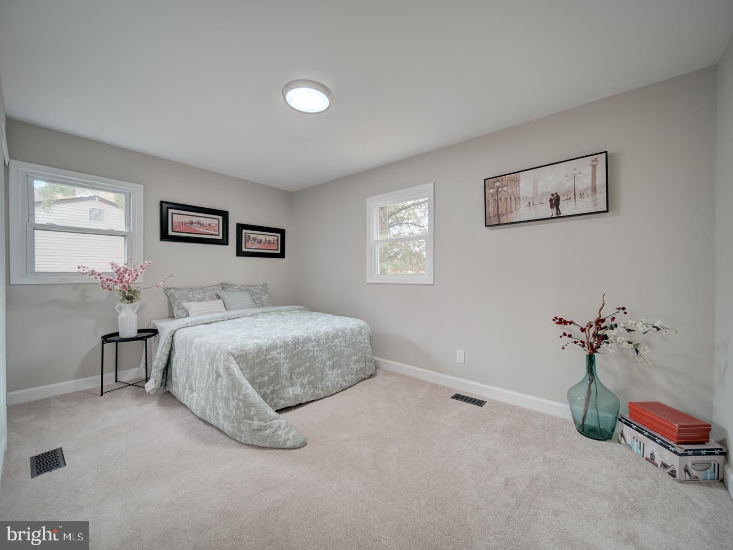 112 Courtney Drive Elkton, MD 21921 - Photo 23 of 40 a bedroom with a bed and a painting on the wall