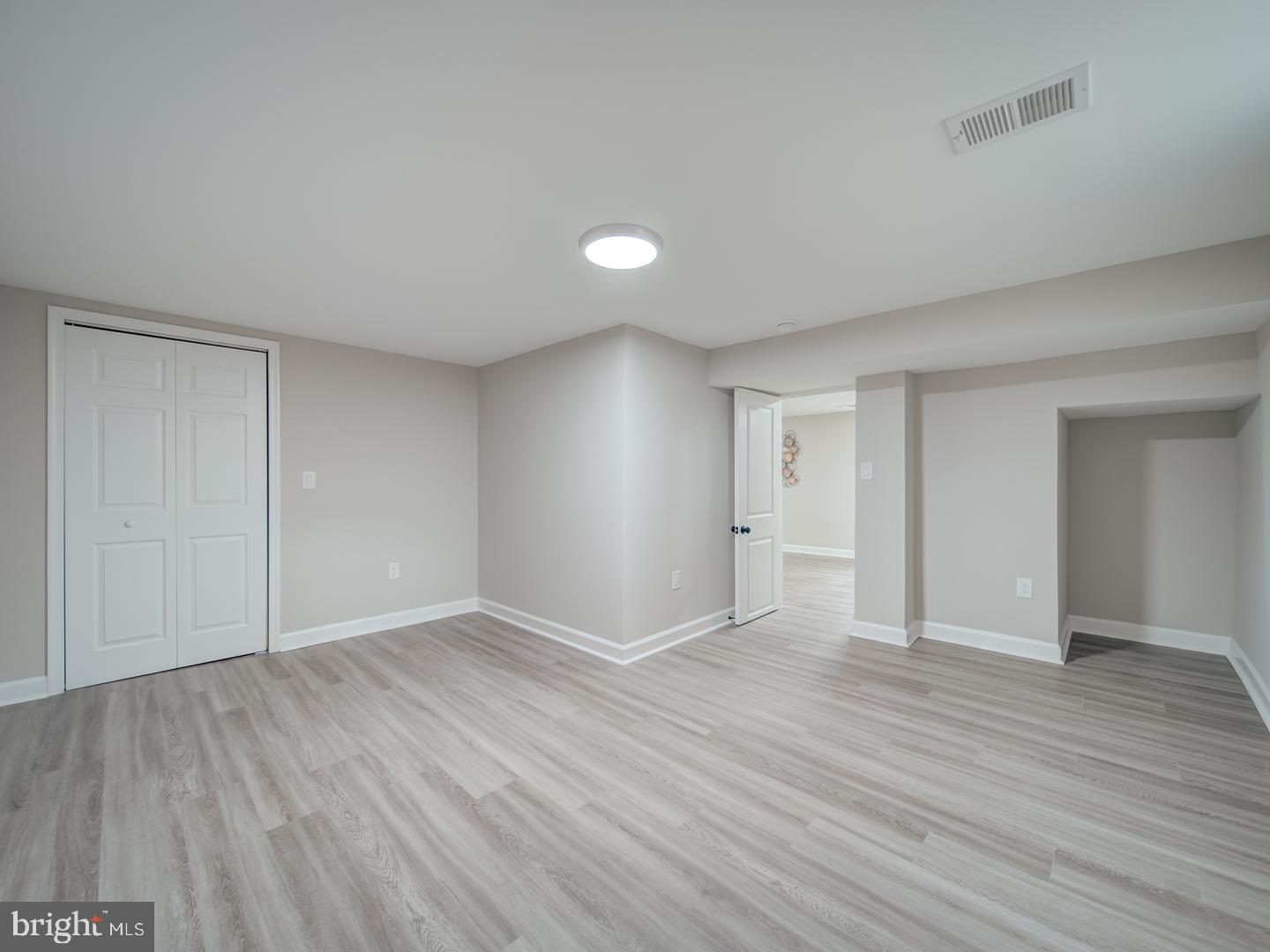 112 Courtney Drive Elkton, MD 21921 - Photo 31 of 40 a view of an empty room with wooden floor