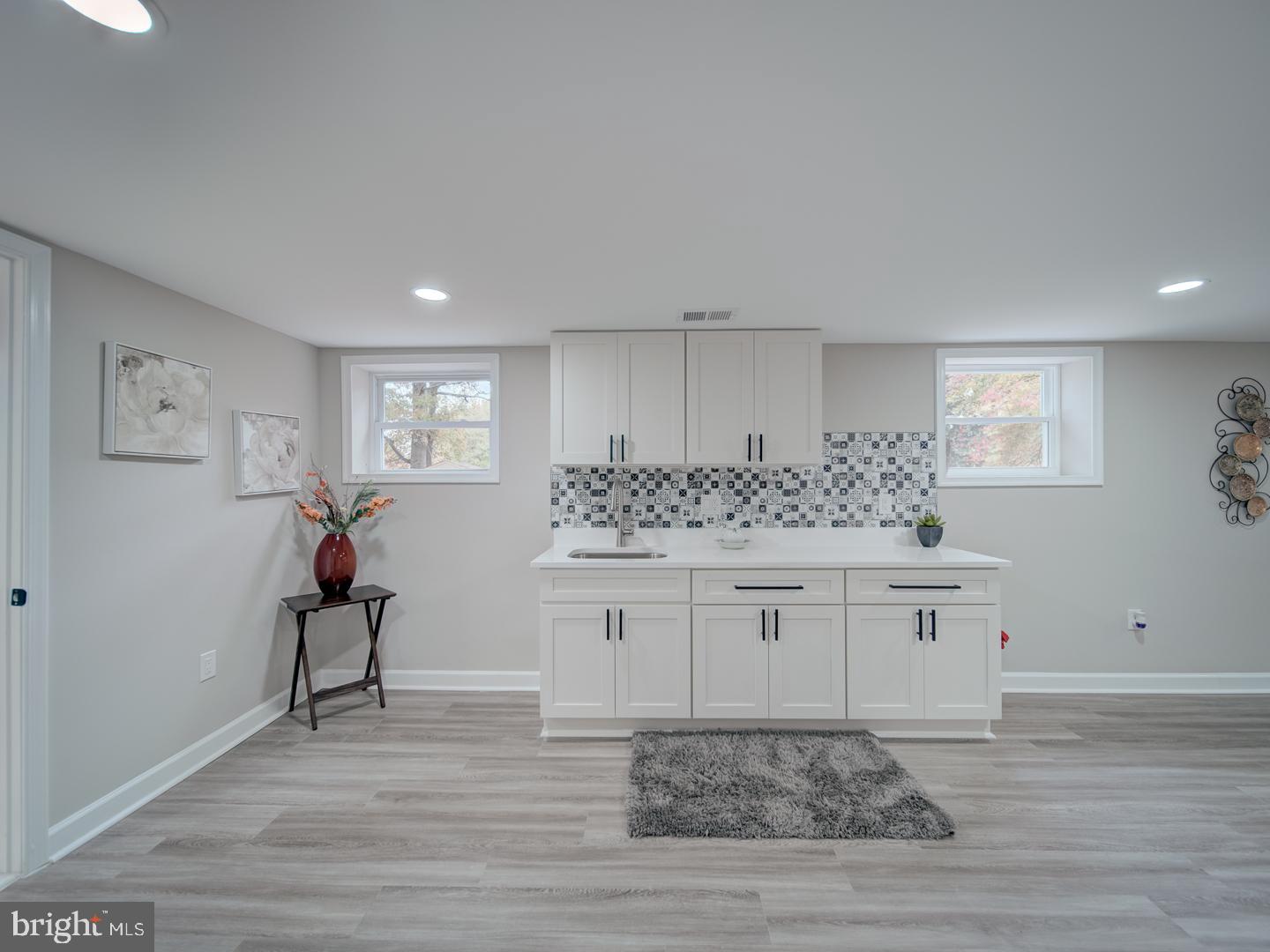 112 Courtney Drive Elkton, MD 21921 - Photo 32 of 40 a room with white cabinets and chandelier