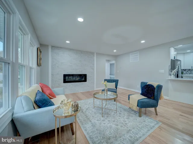 a living room with furniture and a rug