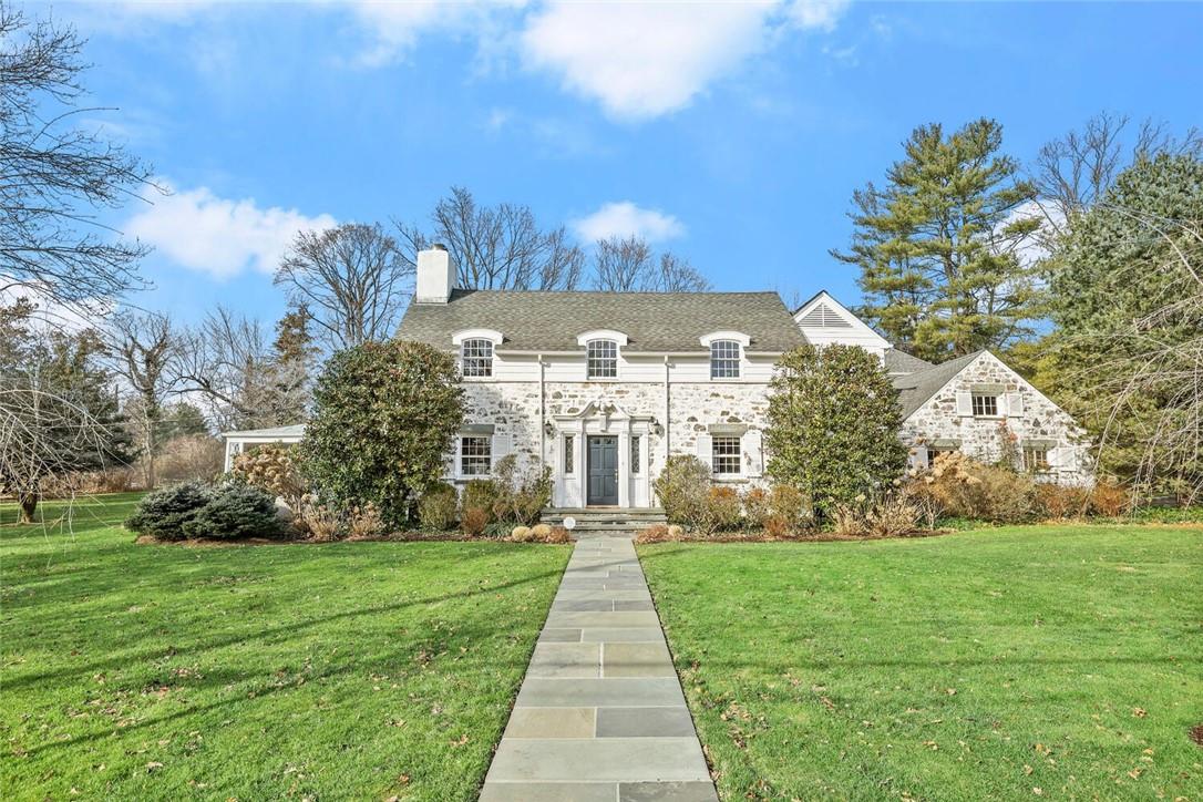 This much loved home reflects both traditional charm and sophistication. The white washed stone and clapboard facade speaks to the architectural details inside.