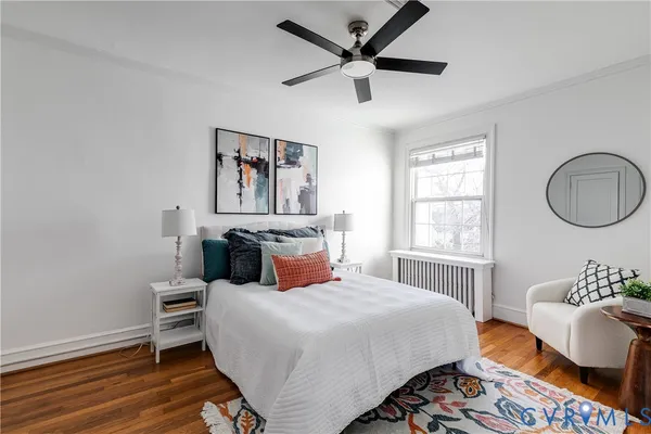 a bedroom with a bed a couch and a window