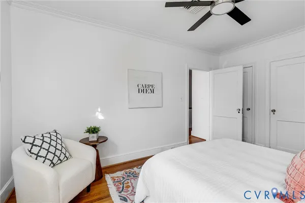 a bedroom with a bed and a couch