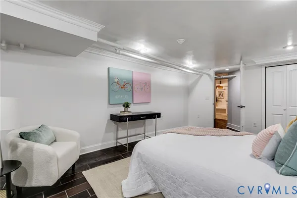 a bedroom with a bed and a chair