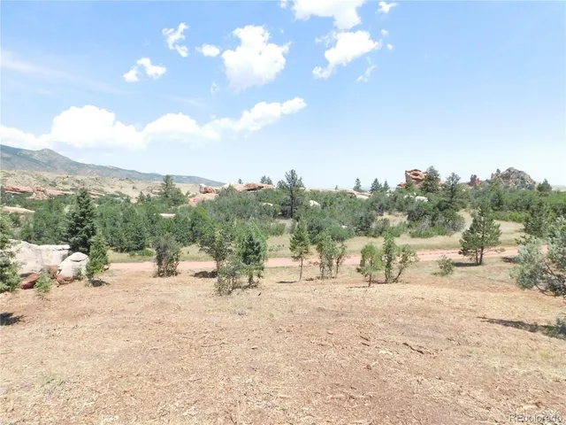 a view of a backyard of the house