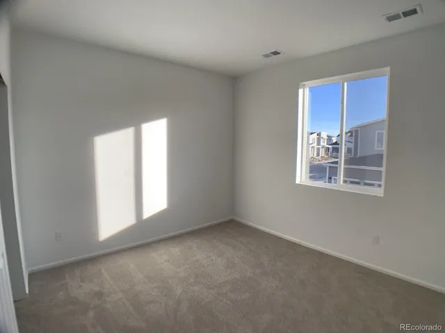 a car parked in front of a house