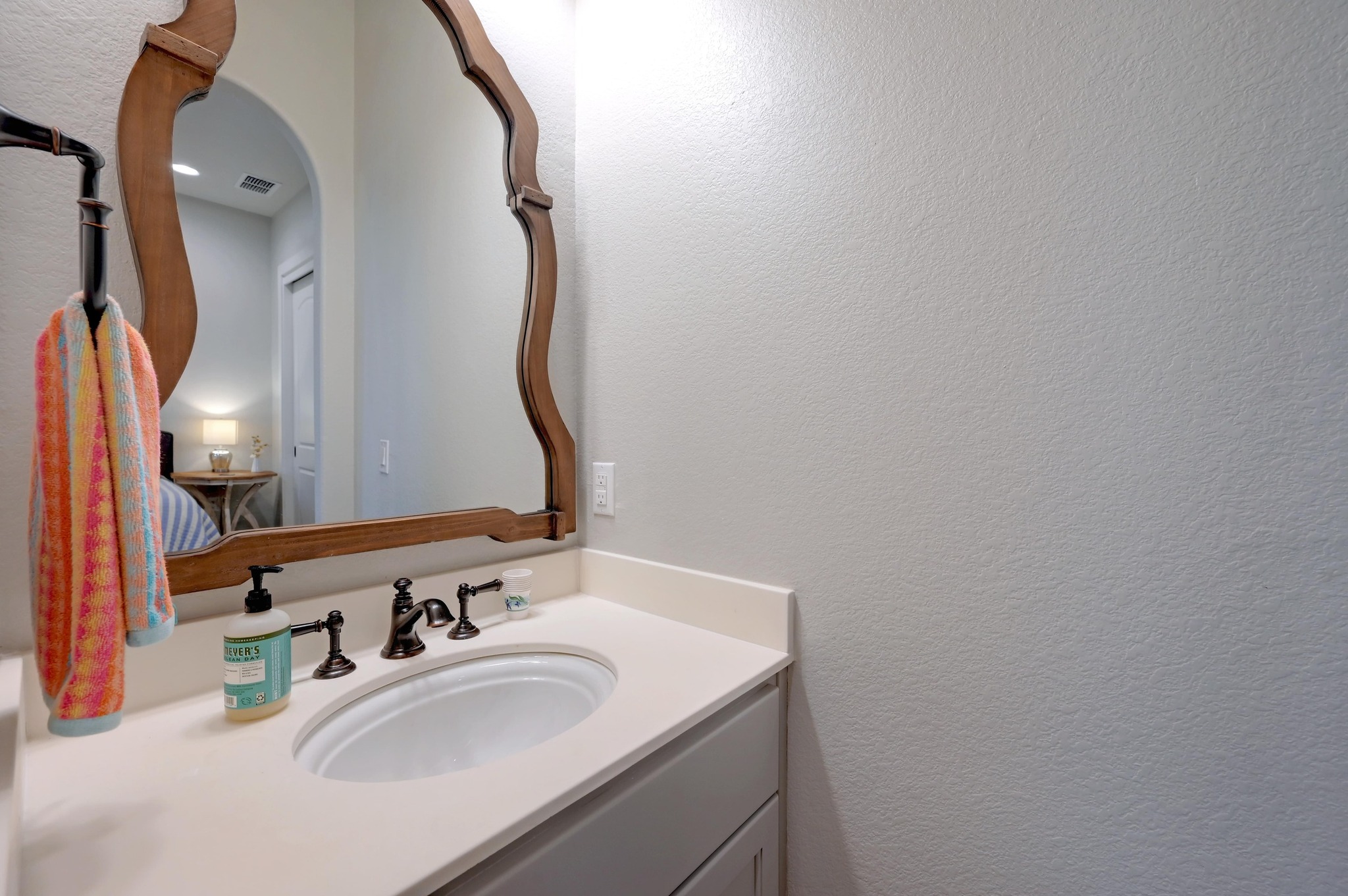 401 Trail Ridge Road Wimberley, TX 78676 - Photo 23 of 34 Bathroom featuring a textured wall and vanity