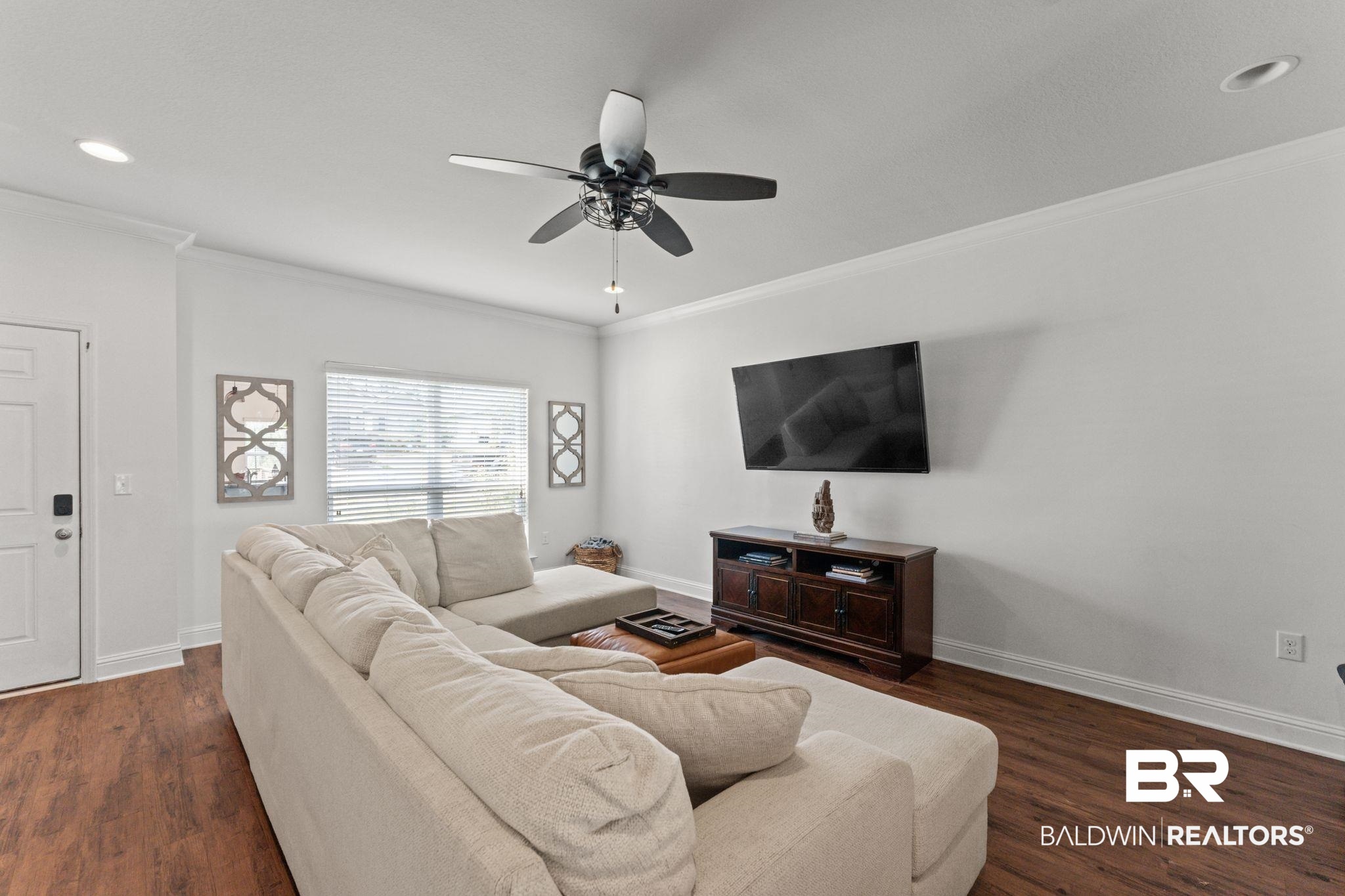 12711 Chickadee Lane Daphne, AL 36527 - Photo 6 of 39 Living area with ornamental molding, dark wood-type flooring, recessed lighting, and a ceiling fan