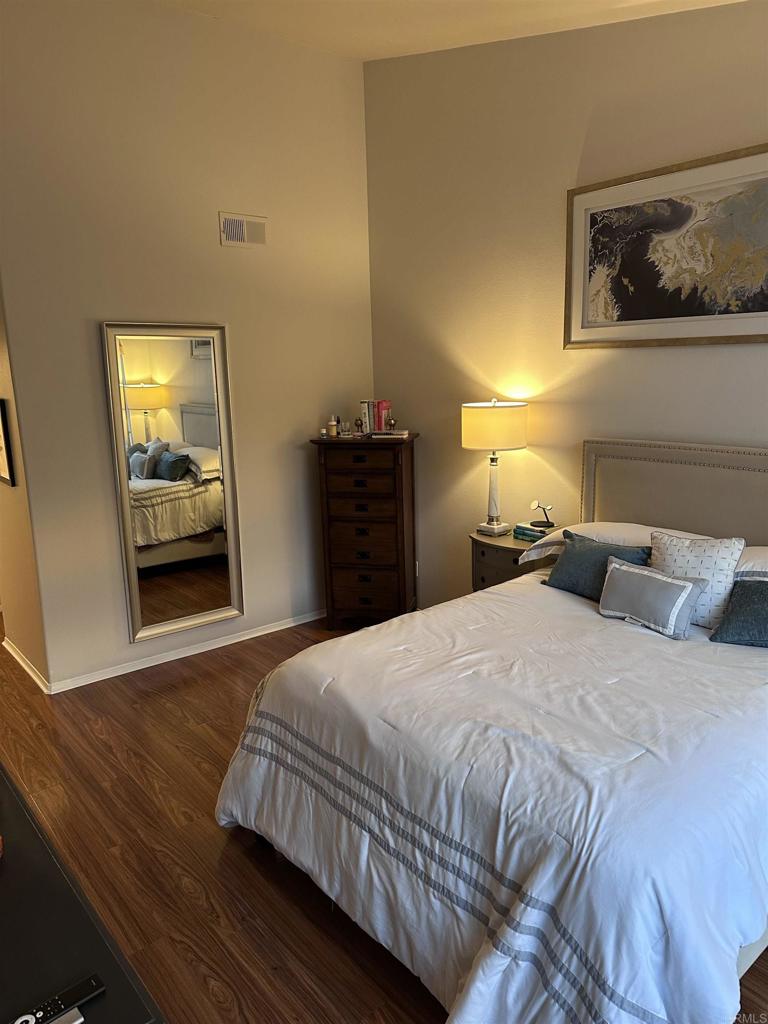 2547 La Costa Avenue Chula Vista, CA 91915 - Photo 11 of 17 a bedroom with a bed and wooden floor