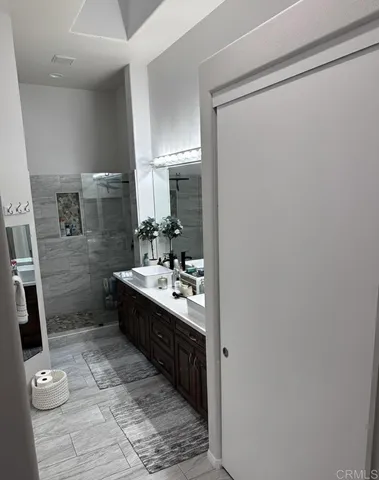 a bathroom with a sink a toilet a mirror and vanity