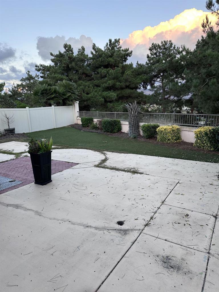 2547 La Costa Avenue Chula Vista, CA 91915 - Photo 15 of 17 a backyard of a house with lots of green space and lake view