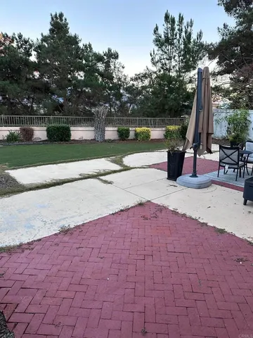 a view of a garden with sitting area