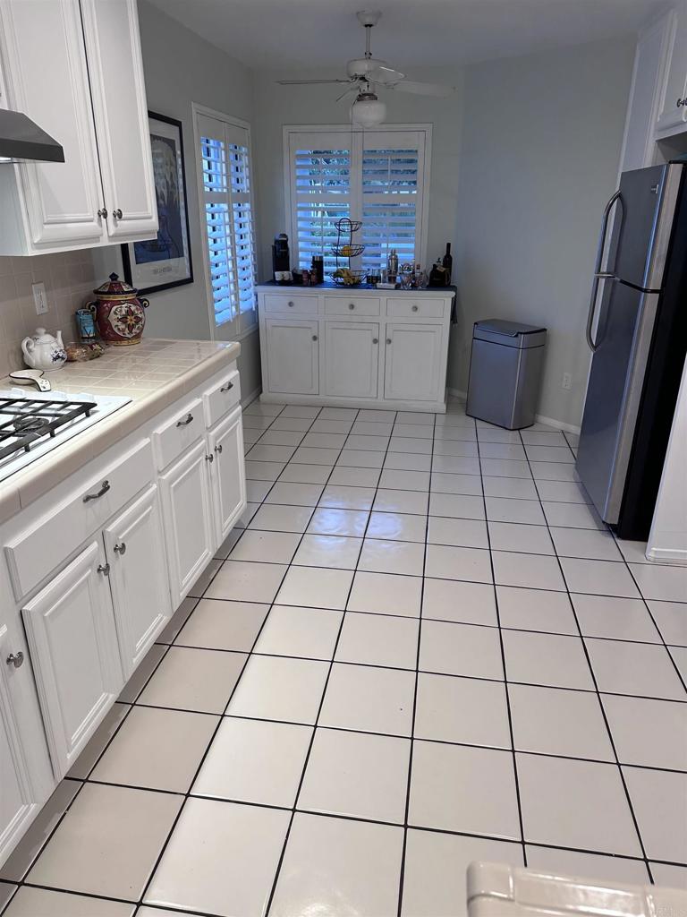2547 La Costa Avenue Chula Vista, CA 91915 - Photo 2 of 17 a kitchen with a sink and cabinets