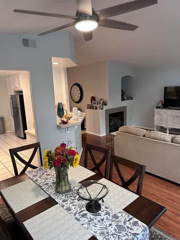 a work room with furniture and wooden floor