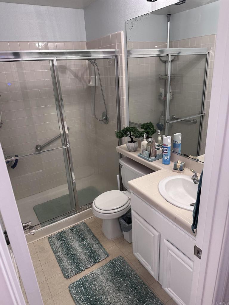 2547 La Costa Avenue Chula Vista, CA 91915 - Photo 10 of 17 a bathroom with a sink toilet and shower