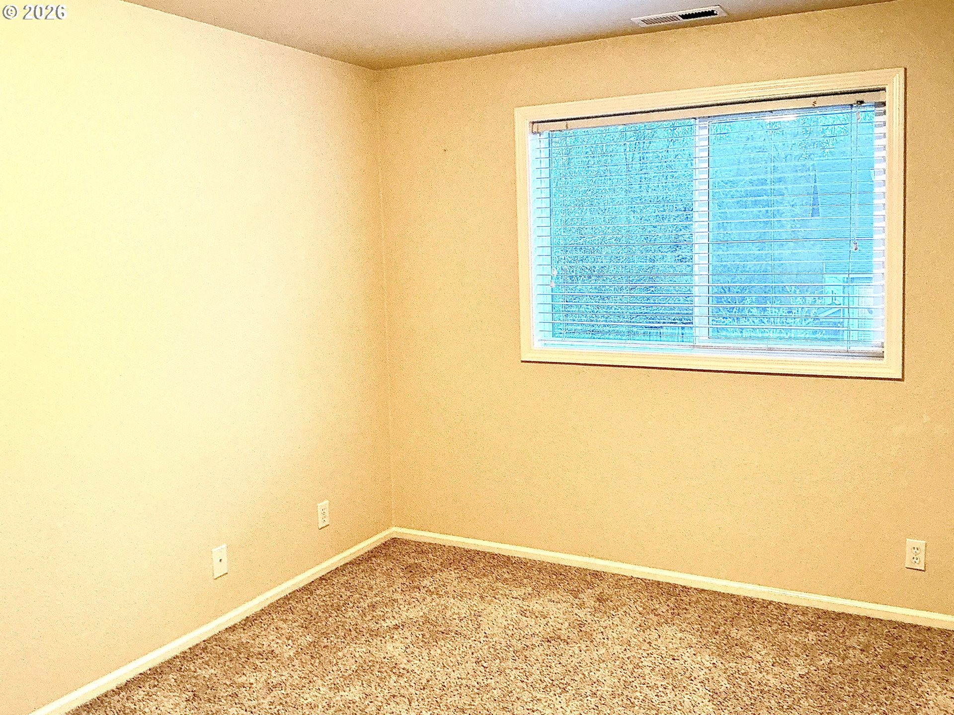 25335 Trinity Street Veneta, OR 97487 - Photo 21 of 27 a view of a blue wall with a large window