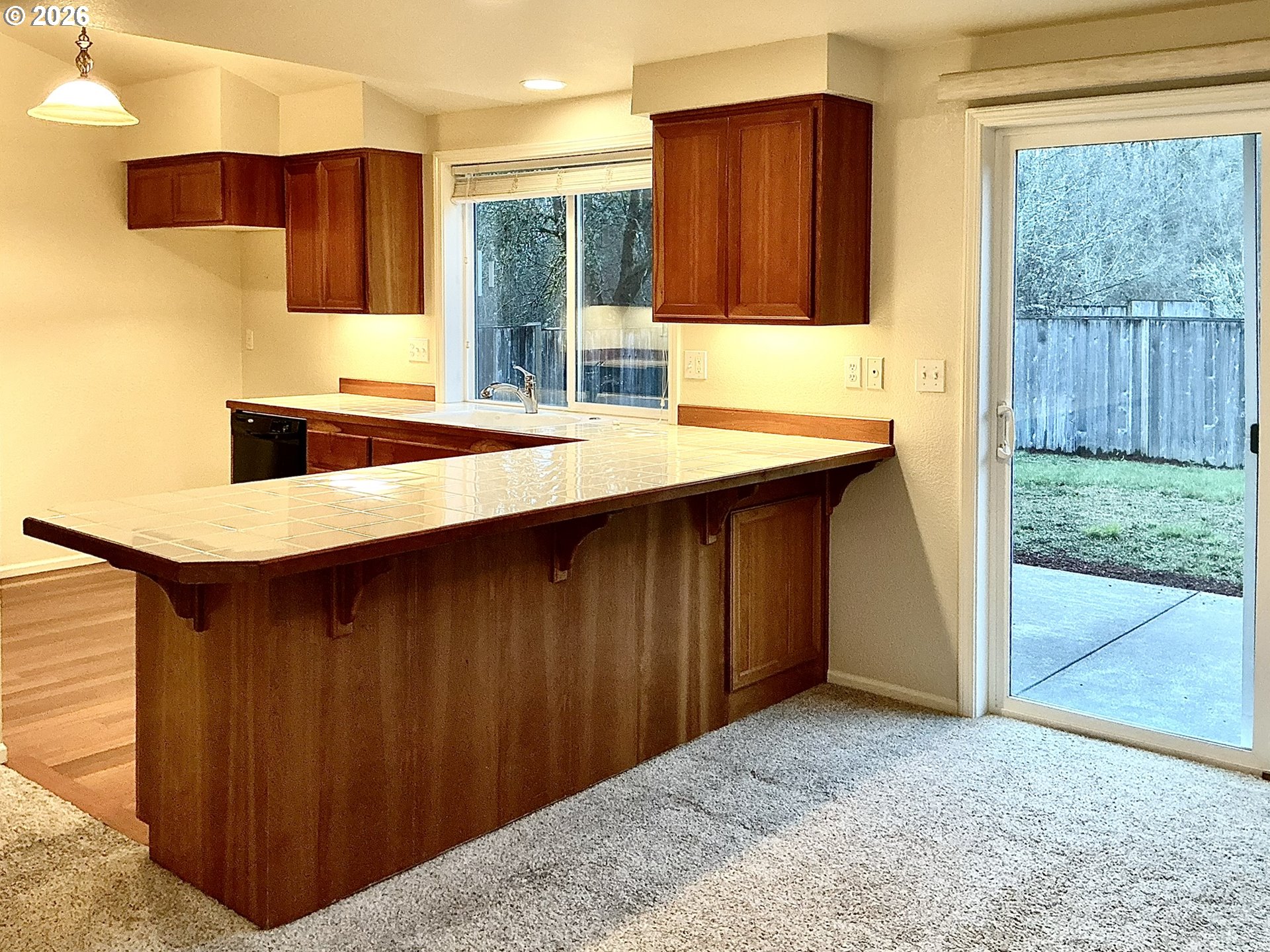 25335 Trinity Street Veneta, OR 97487 - Photo 5 of 27 a kitchen with a sink cabinets and wooden floor