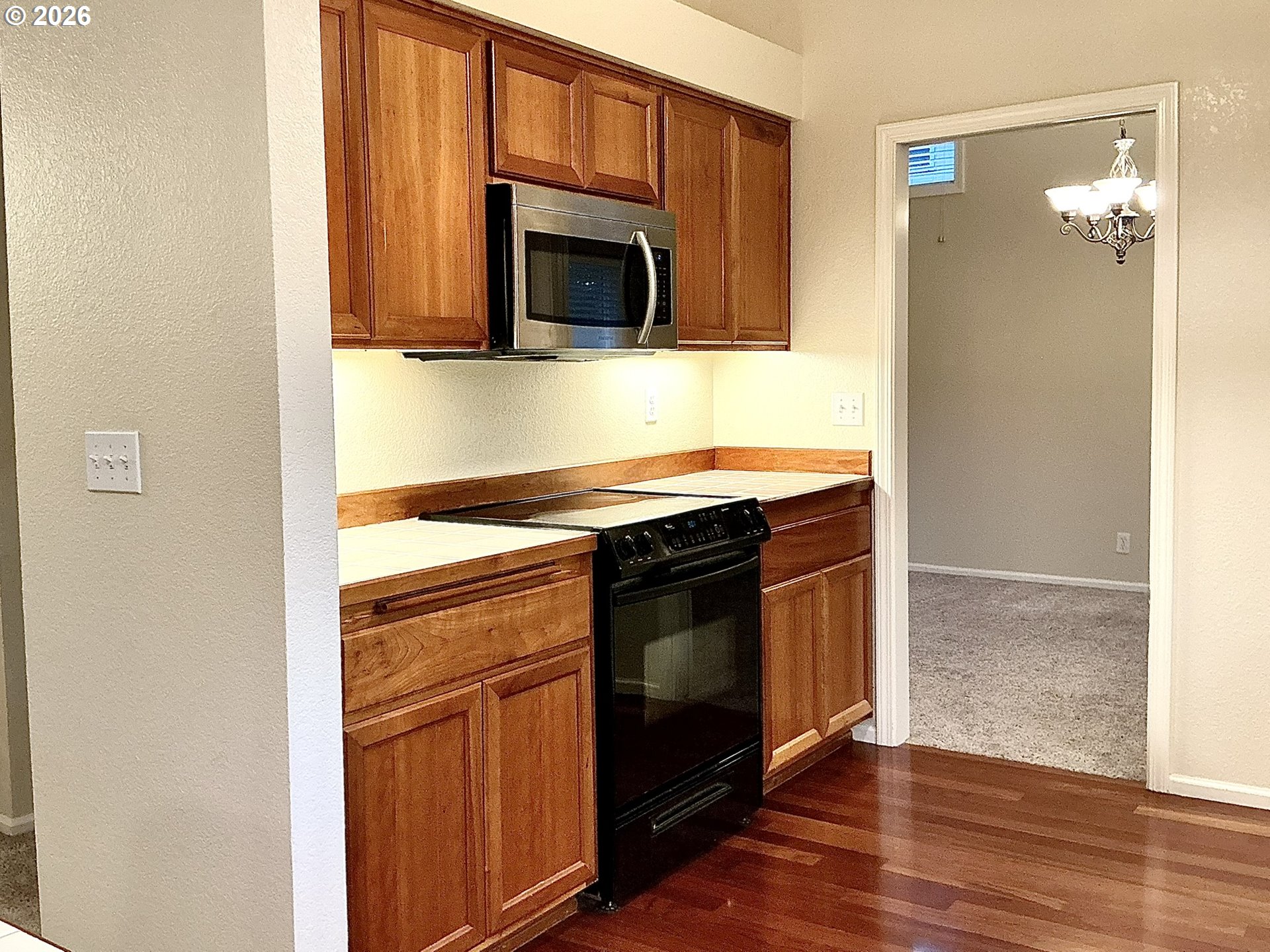 25335 Trinity Street Veneta, OR 97487 - Photo 8 of 27 a kitchen with stainless steel appliances granite countertop a stove microwave and sink