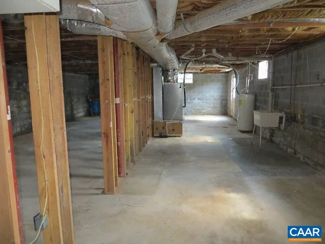 a view of a hallway with wooden shelves