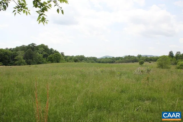 a view of a lake with a yard