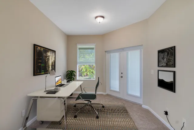 a workspace with furniture and window