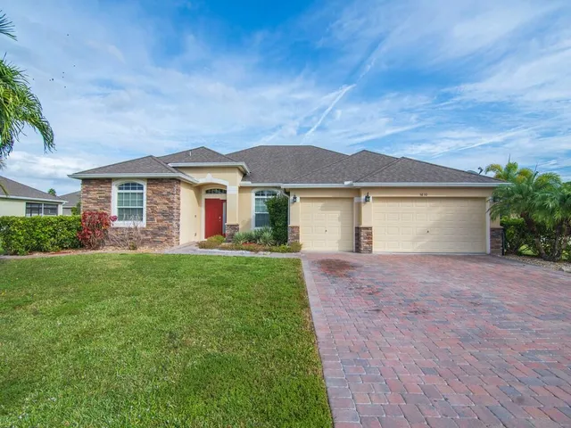 front view of a house with a yard