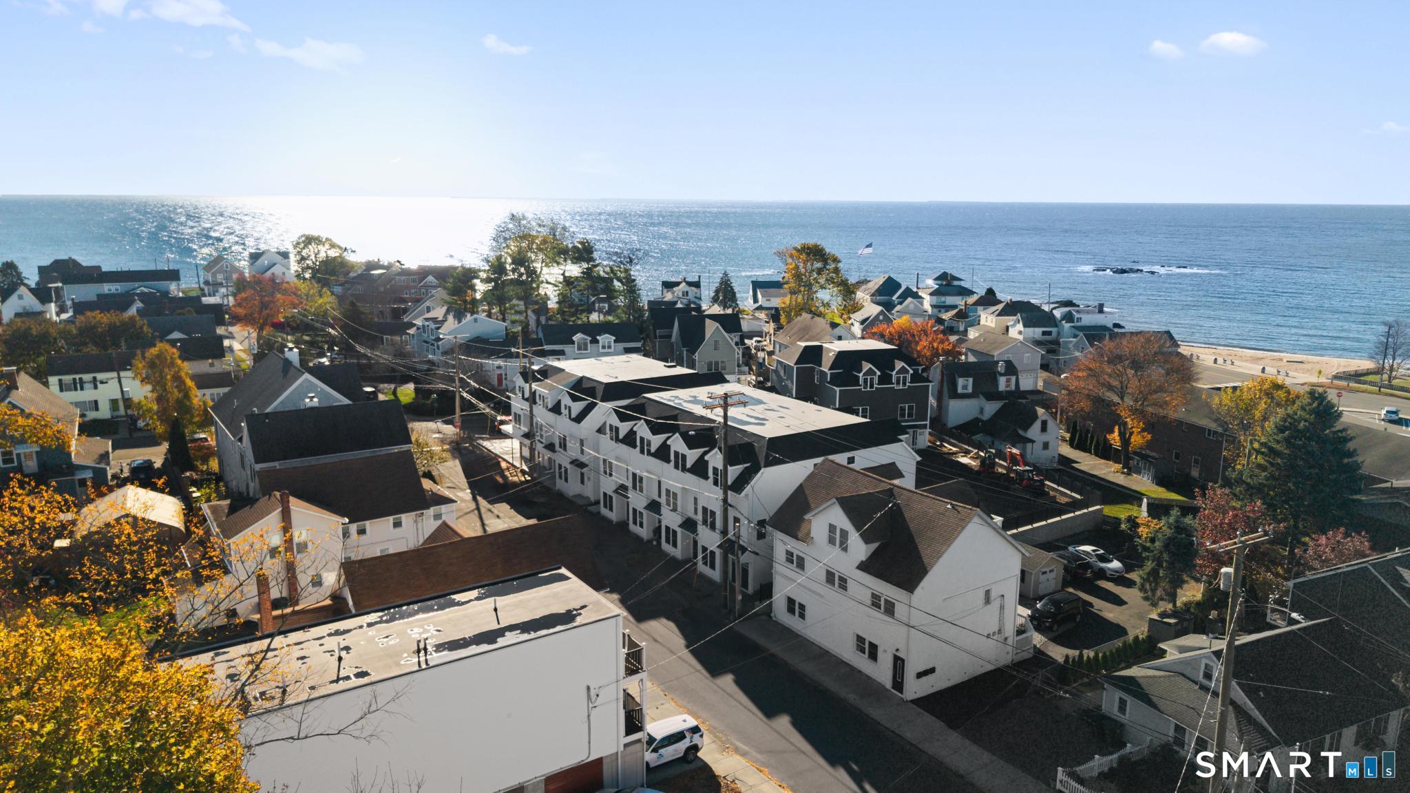 27 Village Road, Unit C Milford, CT 06460 - Photo 5 of 14 an aerial view of a city with lots of residential buildings