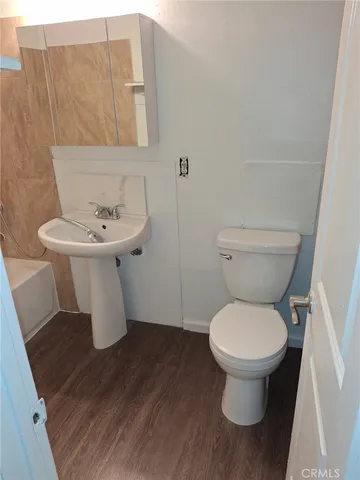 a bathroom with a toilet and a sink