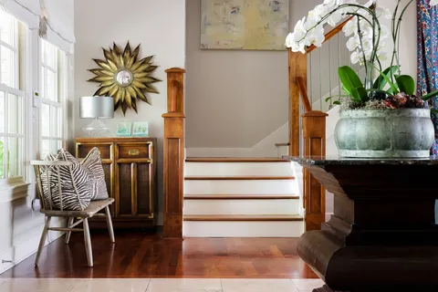 a view of entryway and hall with wooden floor