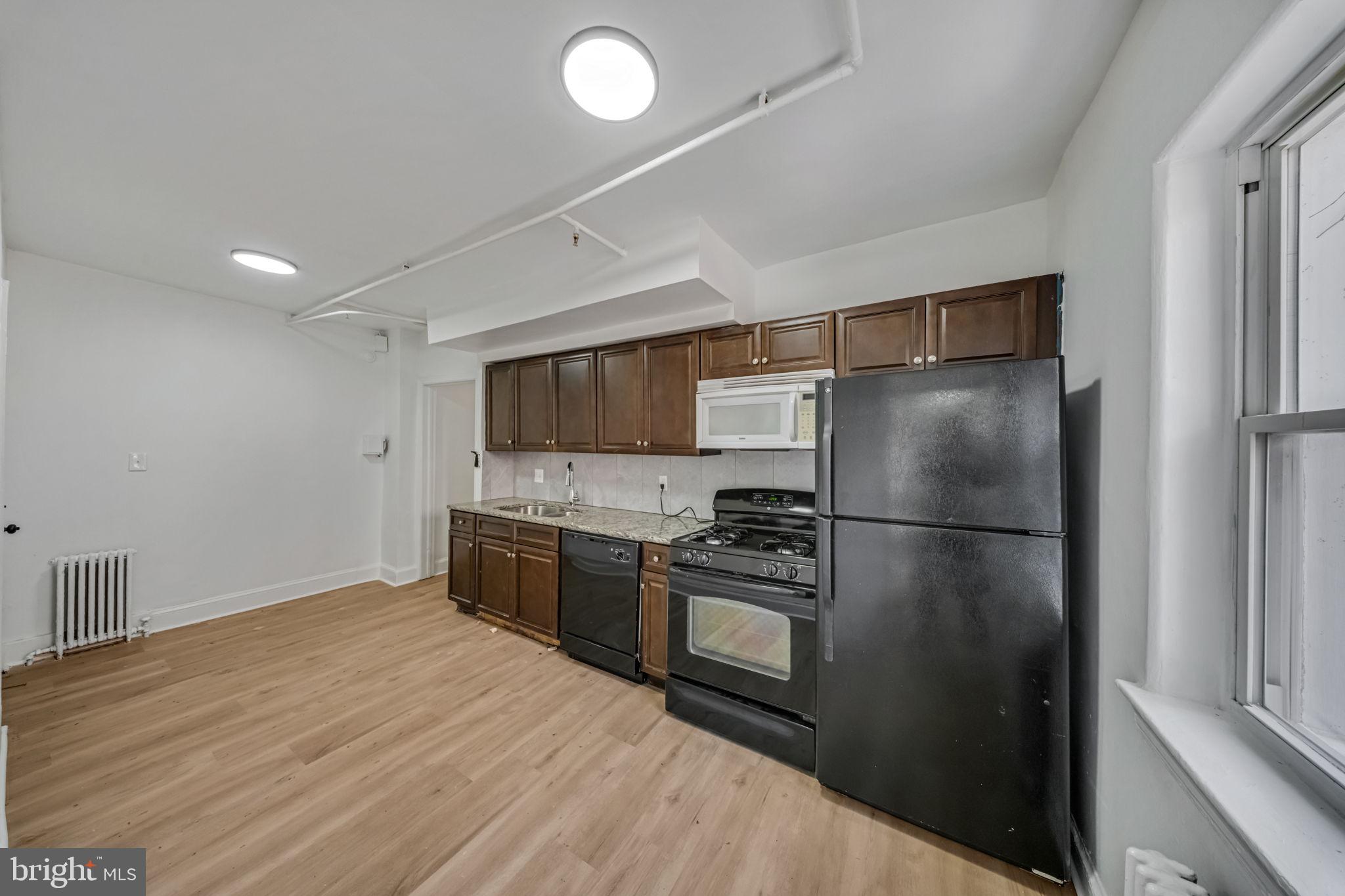 337 Delafield Place Northwest Washington, DC 20011 - Photo 38 of 72 Modern kitchen with sleek finishes.