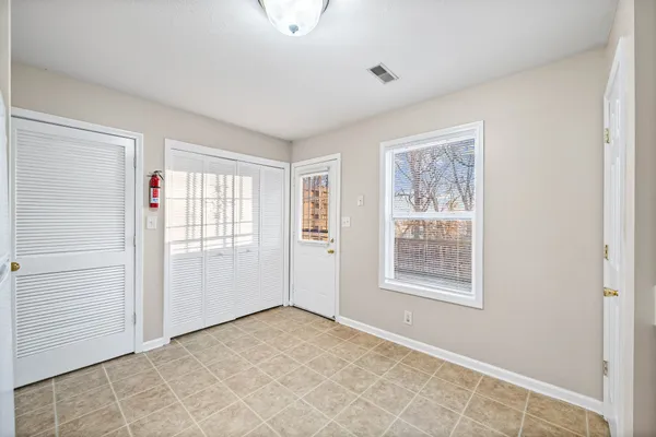 a view of an empty room with a window