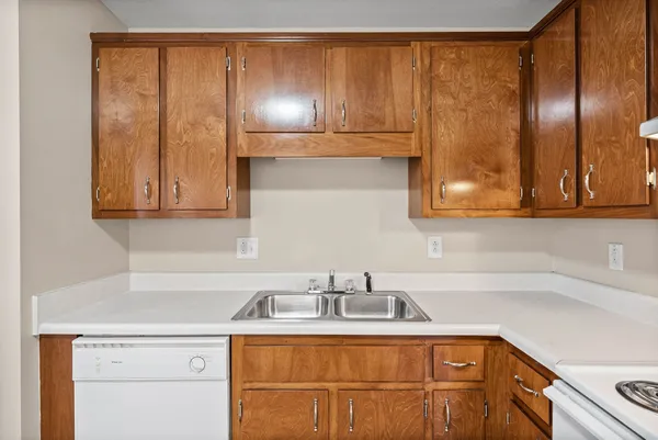 a kitchen with a sink and cabinets