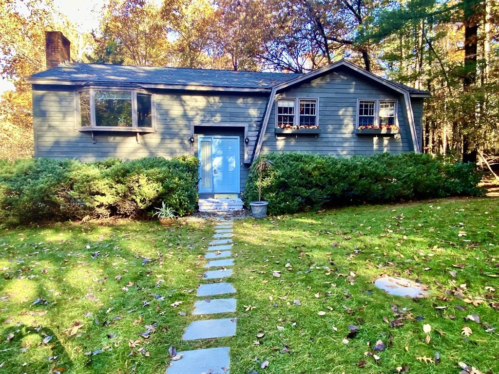 11 Groton Road Tyngsboro, MA 01879 - Photo 1 of 12 a front view of a house with garden